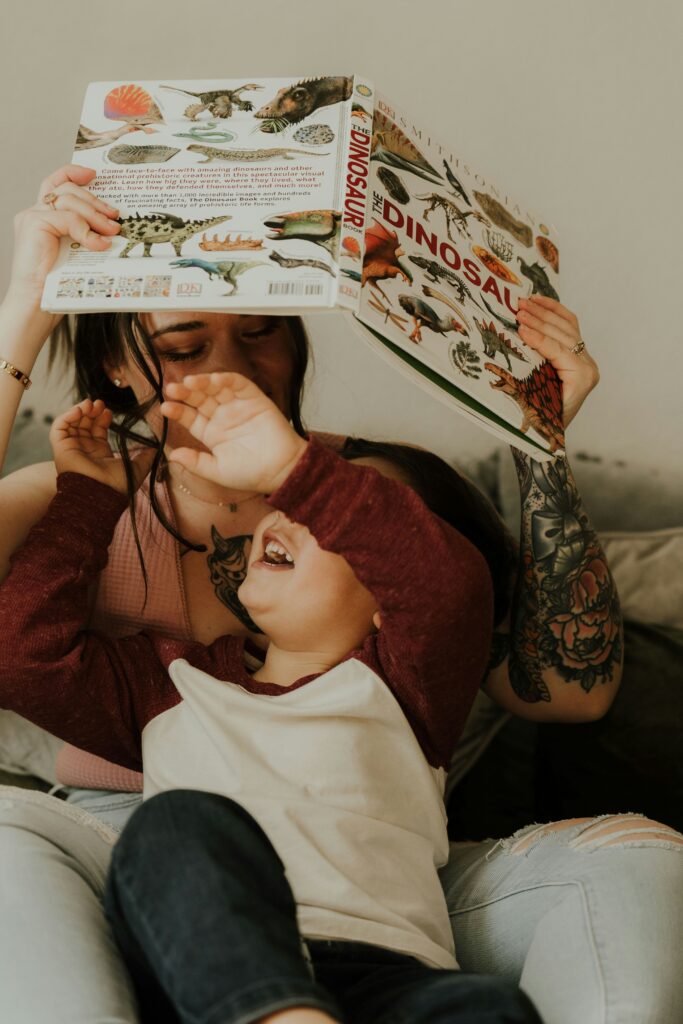 parent and child reading and laughing